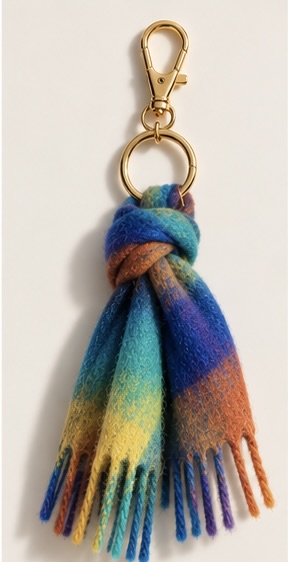 Ribbon keyring in swirling blue, teal, yellow and orange wool
