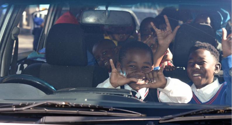 Children smiling together during the Soweto outreach