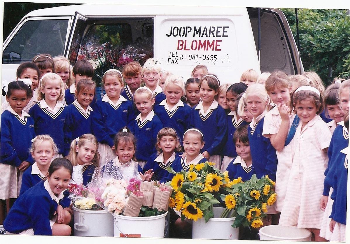 School children gathered with flowers during the Wellington outreach